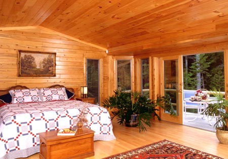 Log home bedroom with a lot of natural light