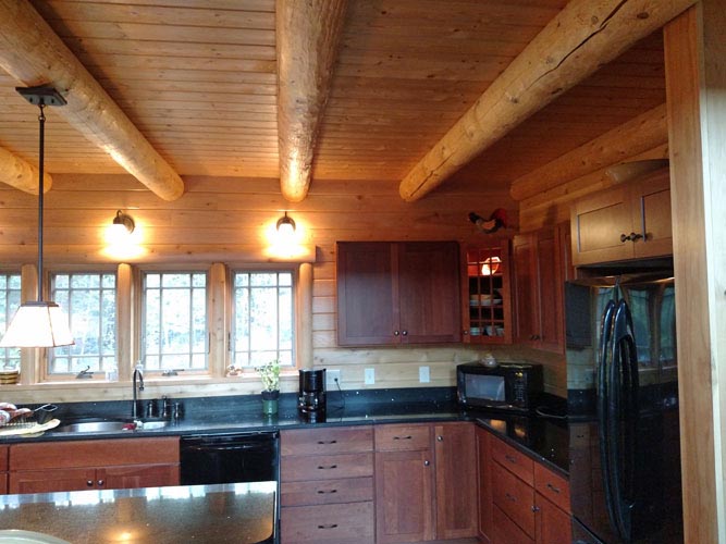 Madison Log Home Kitchen with round beams