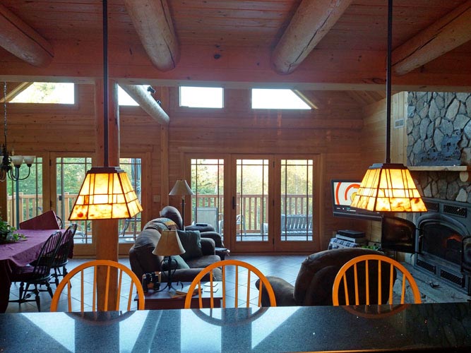 Madison Log Home Kitchen looking into great room