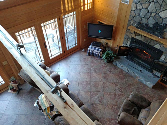 Madison Log Home Loft looking down to Living Room