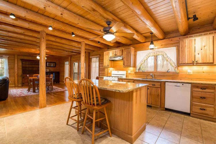 Coopersburg Log Home Kitchen with round beams