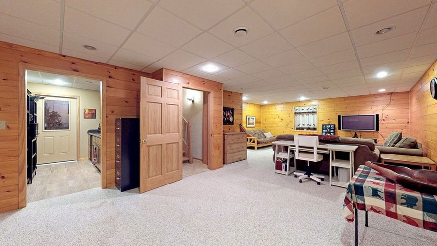 Finished basement of log home with office space