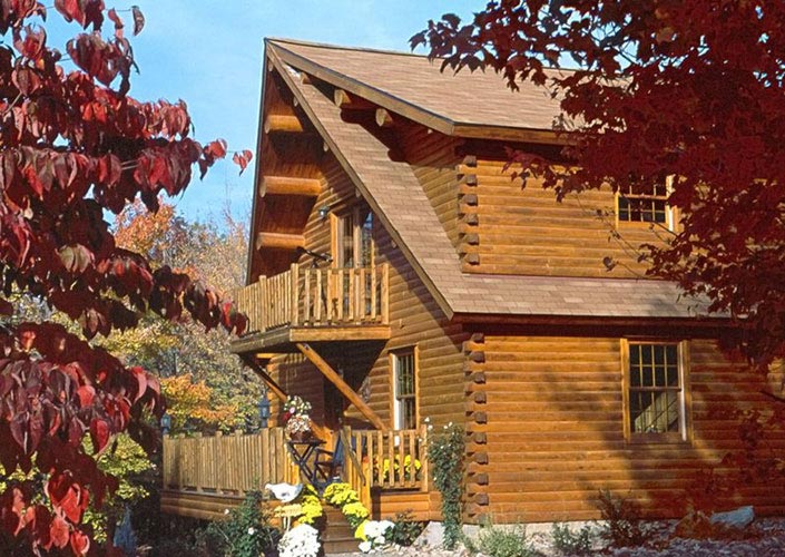 Exterior of log home with balcony