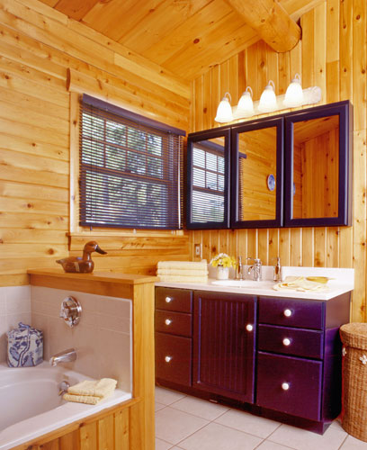 Log home bathroom with large dark cherry vanity