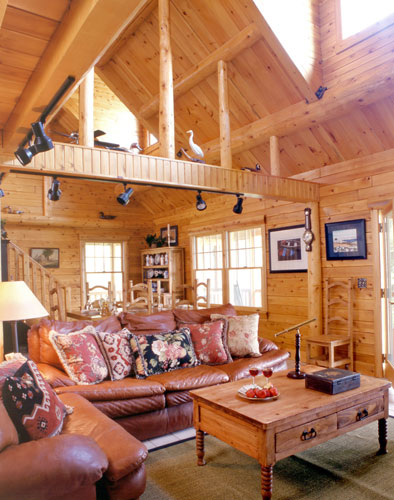 Great room with leather furniture and purlins