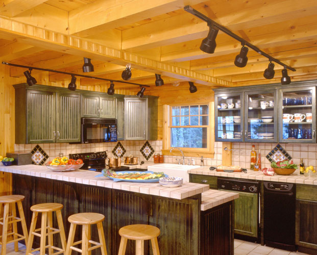 Kitchen in log home with bar counter for extra seating