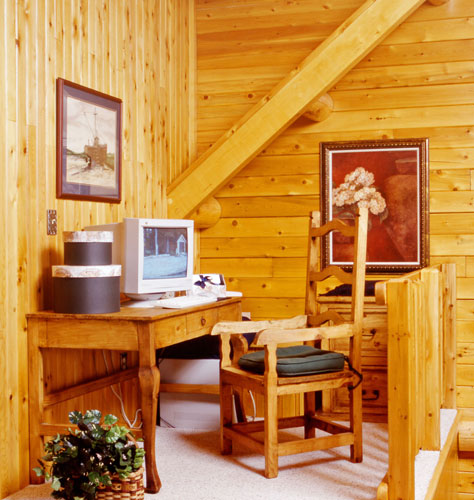 Office nook in loft of log home