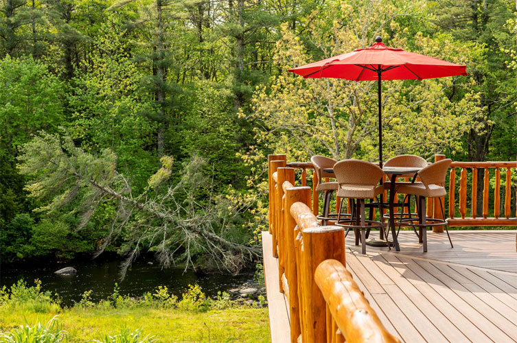 Deck overlooking river in backyard