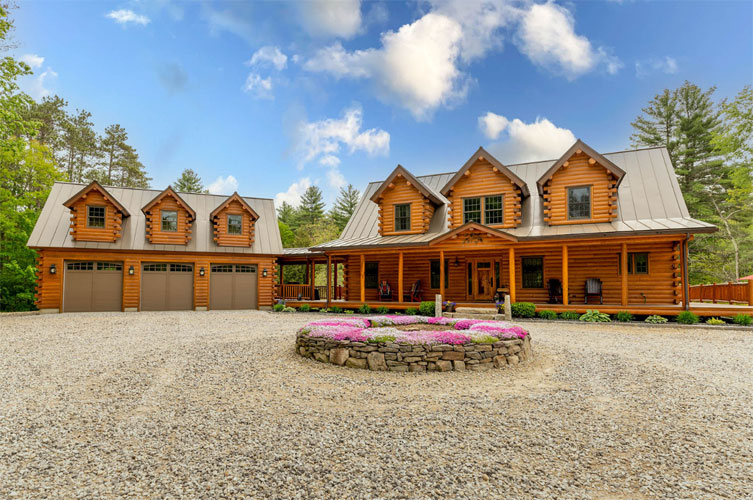 Exterior of Ward Log Home with dormer on house and garage