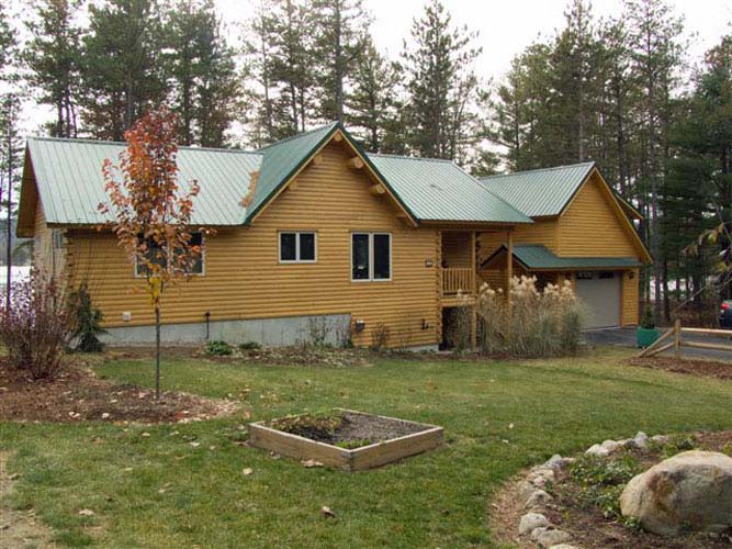 View of the backyard of this custom log home