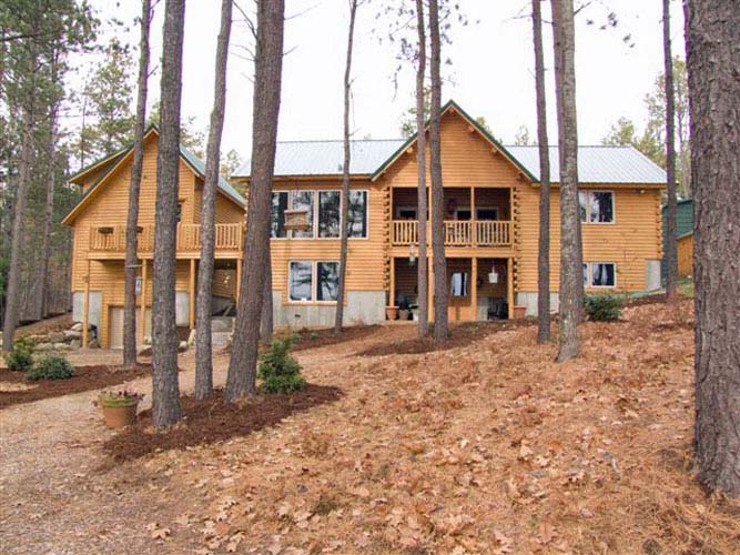 Log Home Exterior looking through trees