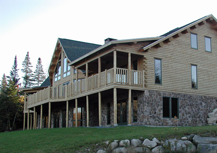Exterior of log home with walkout basement
