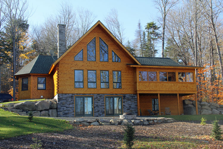 Log home with lots of gable glass