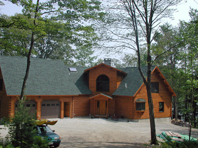 Log Home exterior with attached garage