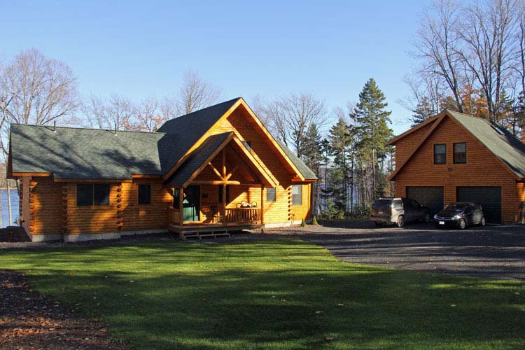 Ward log home with gable porch entrance