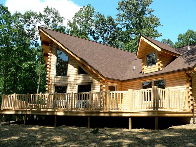 Exterior of log home with large deck