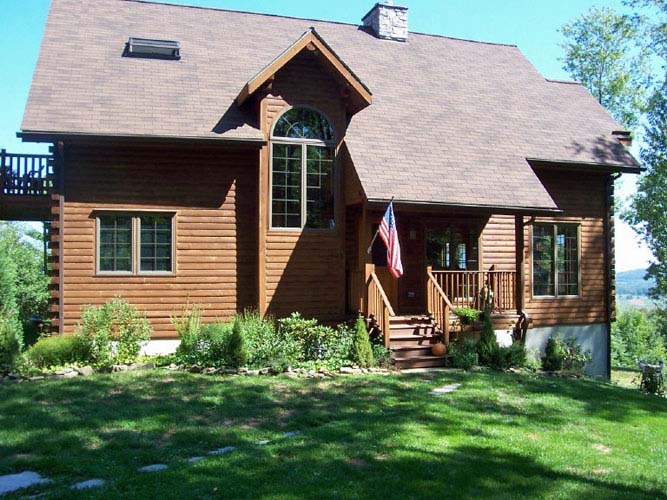 Point Judith log home exterior with entry porch