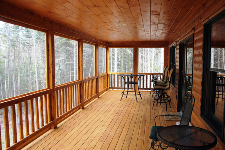 Long covered log home porch