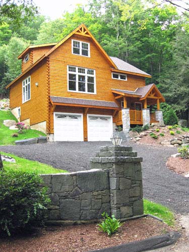 Log home exterior with garage