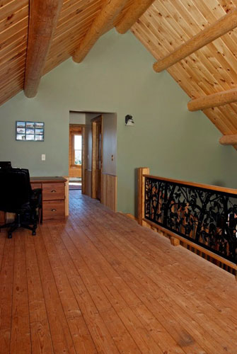 Log Home Hybrid loft with round beams