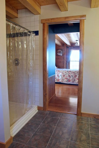 Log Home Hybrid bath with wood beams