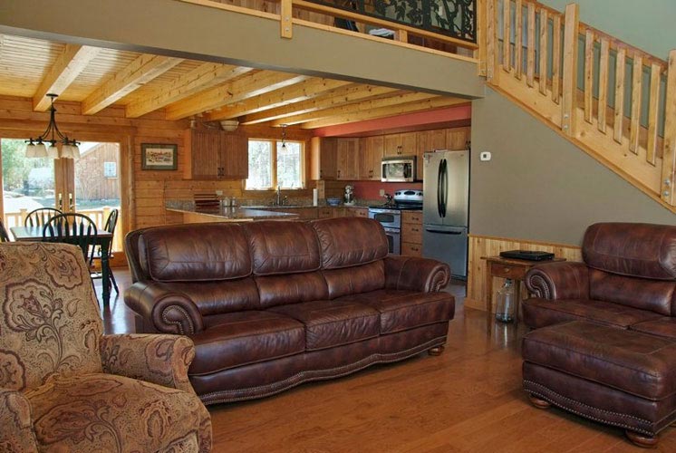 Log Home Hybrid Great Room with woods floors