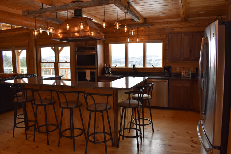 Log Home Kitchen with overhead hood