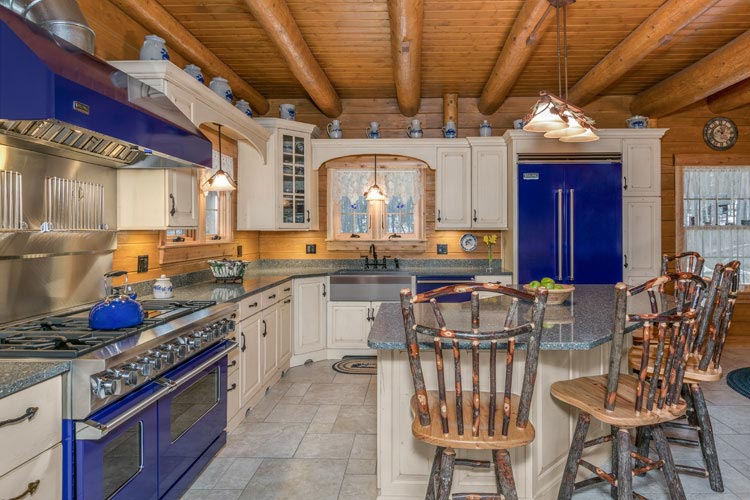 Log Home Kitchen showing bar stools