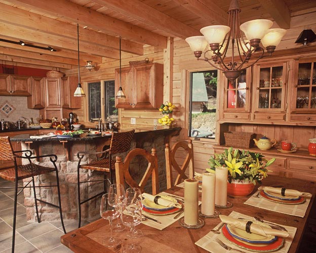 Dining and kitchen with exposed beams