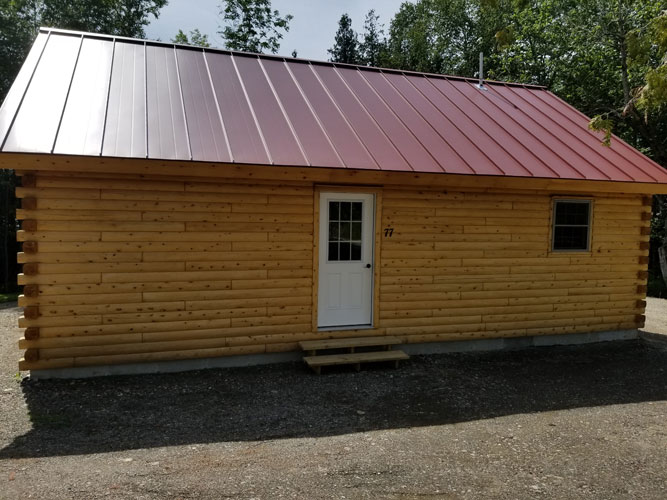 Back view of Musquash log cabin