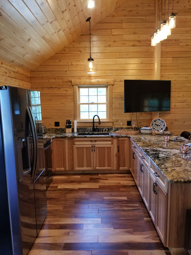 Open kitchen of Musquash log cabin