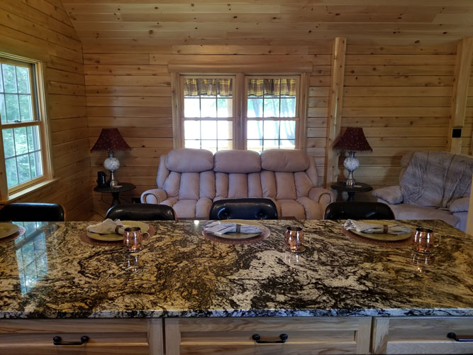 View into living room of Musquash log cabin