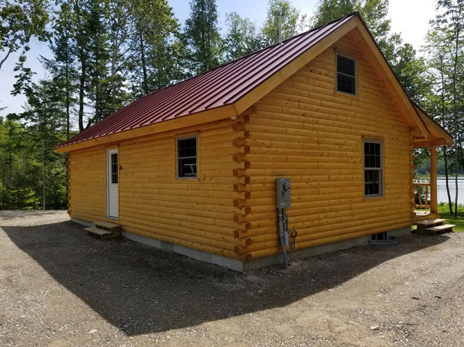 Side view of Musquash log cabin