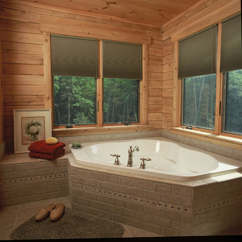 Bathroom with corner tub and double windows