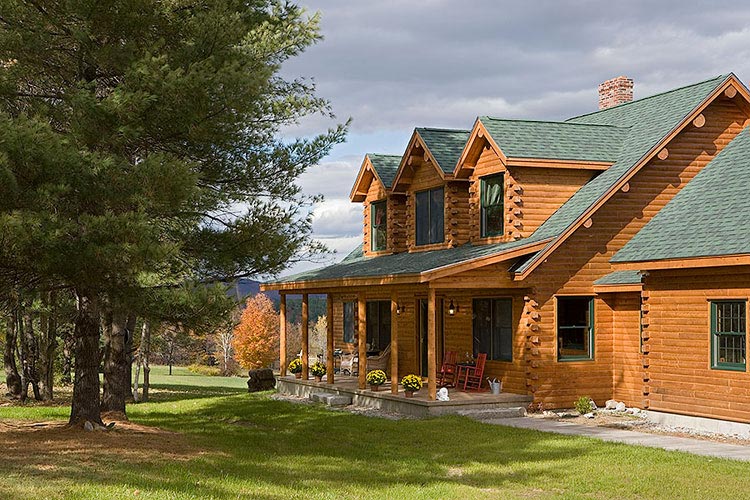 Log home exterior with 3 gable dormers in loft