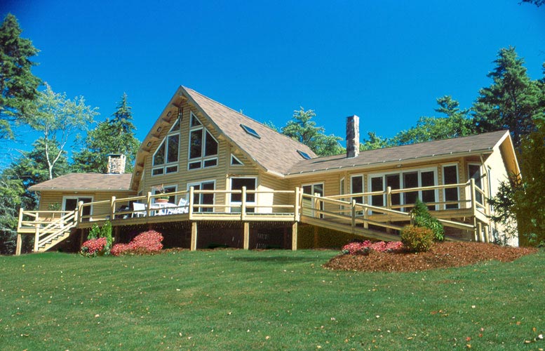 Exterior of log home with landscaping 