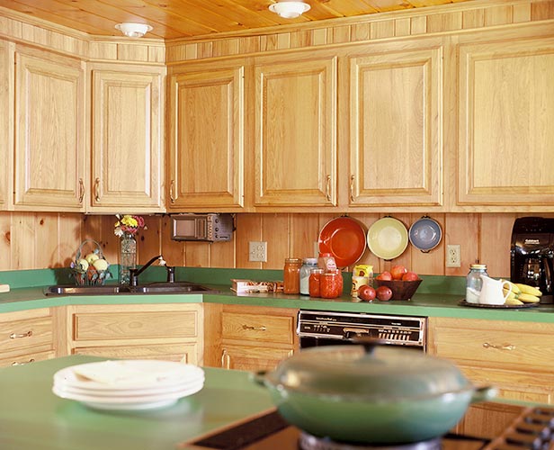 Kitchen cabinets with green counter-top