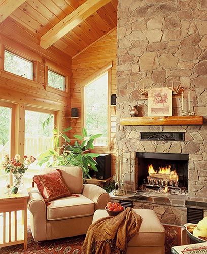 Cozy fireplace and beige chairs